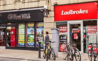 A Picture of a Street with William Hill and Ladbrokes Locations next to One Another 