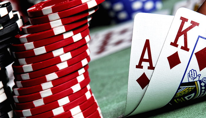 Casino Card Combination with Stacks of Chips on a Green Surface 